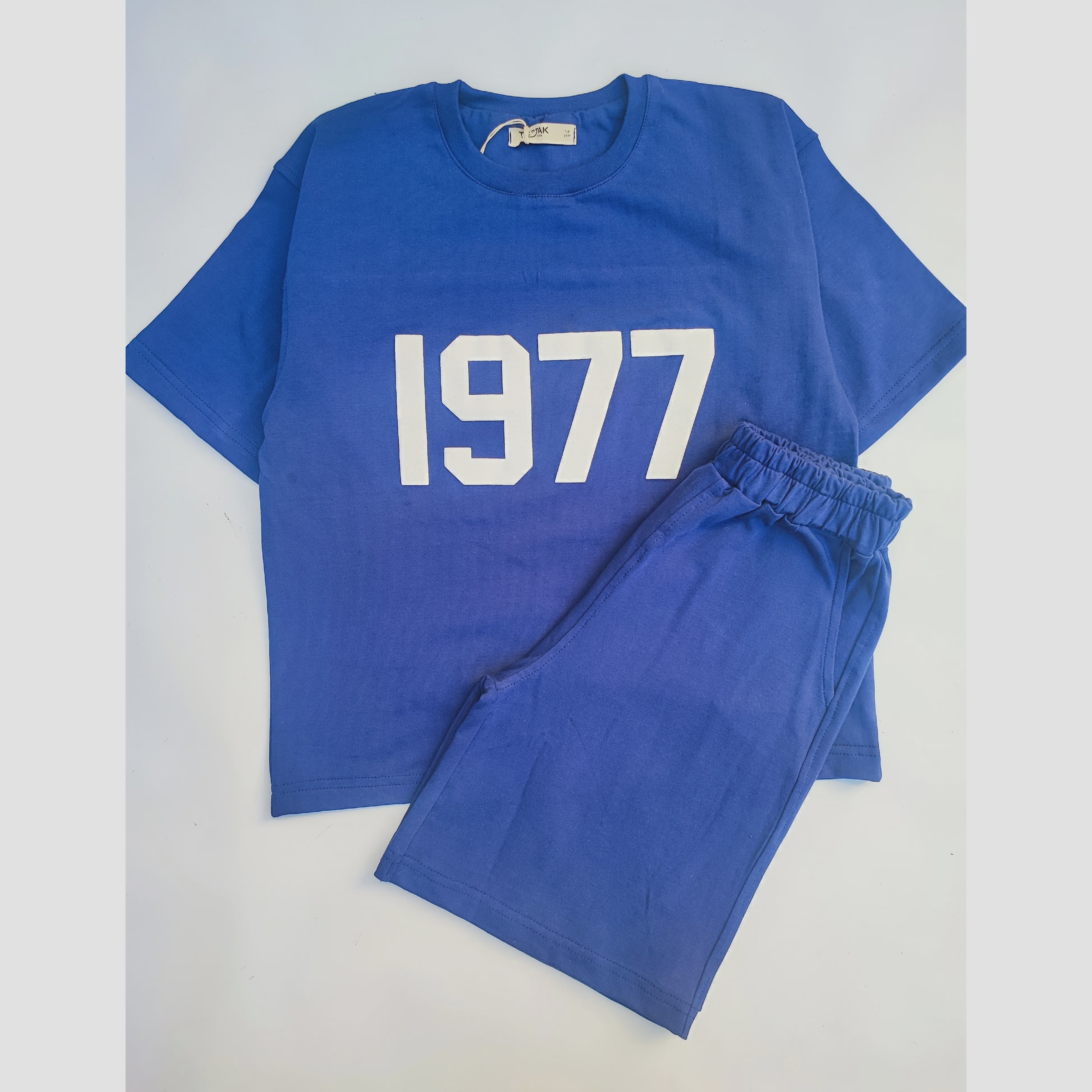 ست تیشرت و شلوارک اسپرت پسرانه و دخترانه طرح 1977 رنگ سرمه ای سایز 55 تا 75